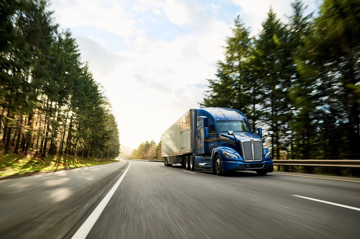 kenworth truck driving in the forest