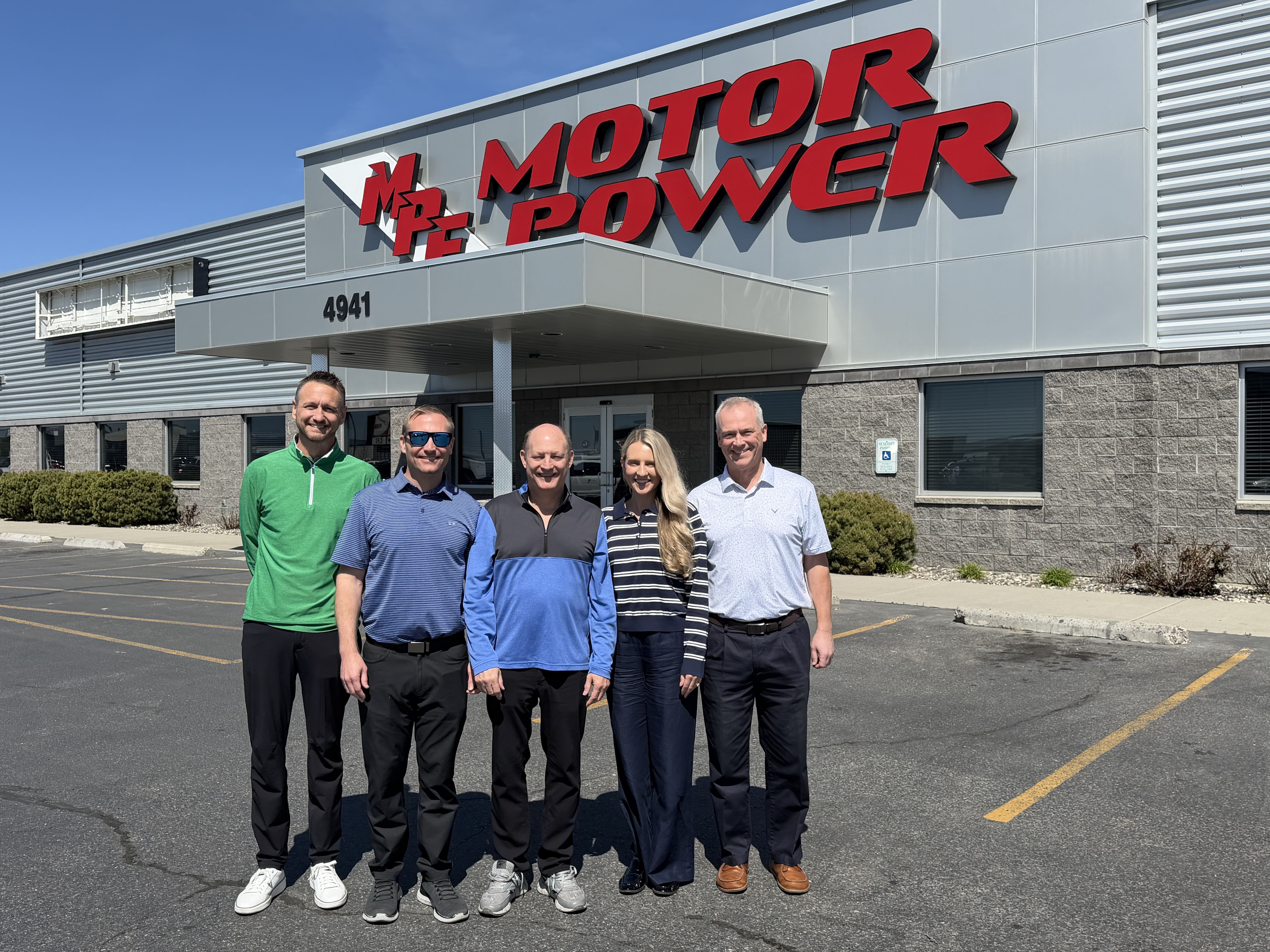 people from WWT and Motor Power are standing together