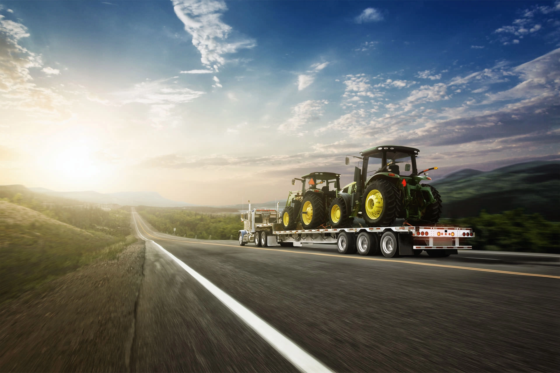 Prestige trailer with tractors on it