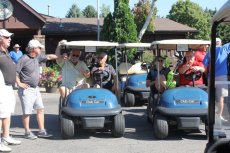 Wallwork's employees riding on golf cars