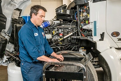 Wallwork Truck technician checking truck trailer parts